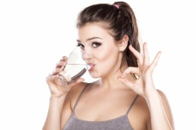 The girl drinks clean water